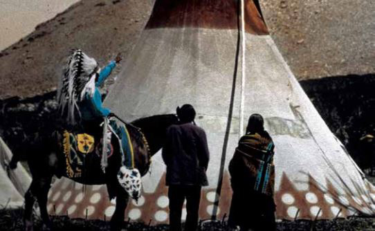 A Blackfoot tipi with people and a horse. Glacier NP Digital Image Library