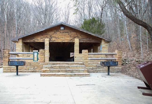 Civic Park Picnic Shelter showing trash receptacles and grills.