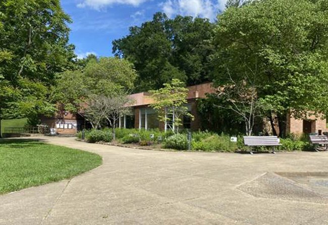 Front building view of visitor center showing the pave walk way.