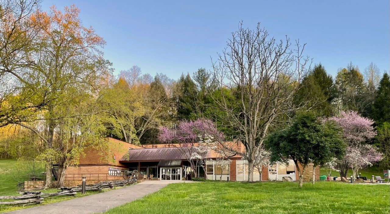 Visitor center in spring with dogwood and redbud trees blooming