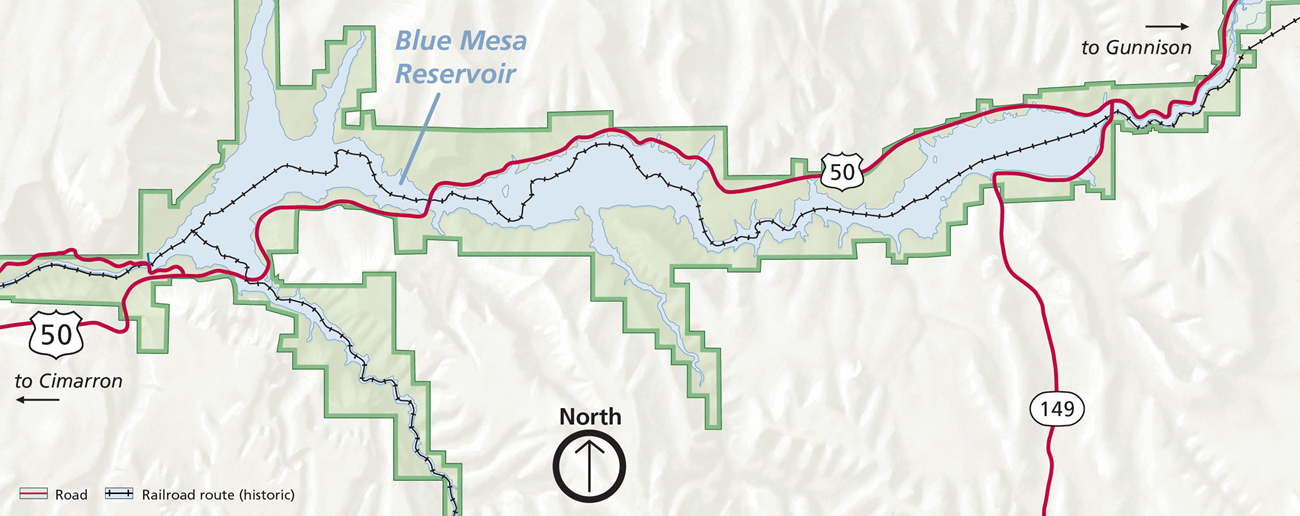 Map of present-day Curecanti with blue shading for water and green shading for park boundaries. Red lines run horizontally showing highways. Black lines with small tick lines show historic railroad tracks. A map legend is in the bottom left corner.