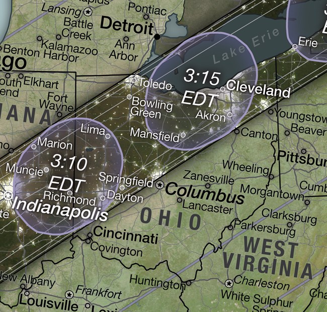 Illustrated map of Ohio and surrounding area; a dark band runs from the lower left to the upper right, representing the path of the moon’s shadow during the eclipse; oblong purple ovals within this band represent the moon’s shadow at particular times.
