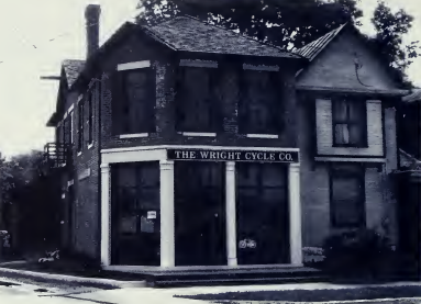 A brick facade of a Wright brothers bike shop