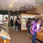 Kids on a field trip inside Wright Cycle Shop