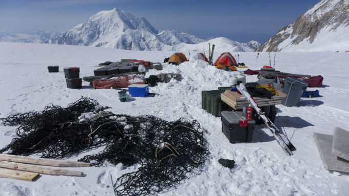 Nets and gear and tents on a glacier