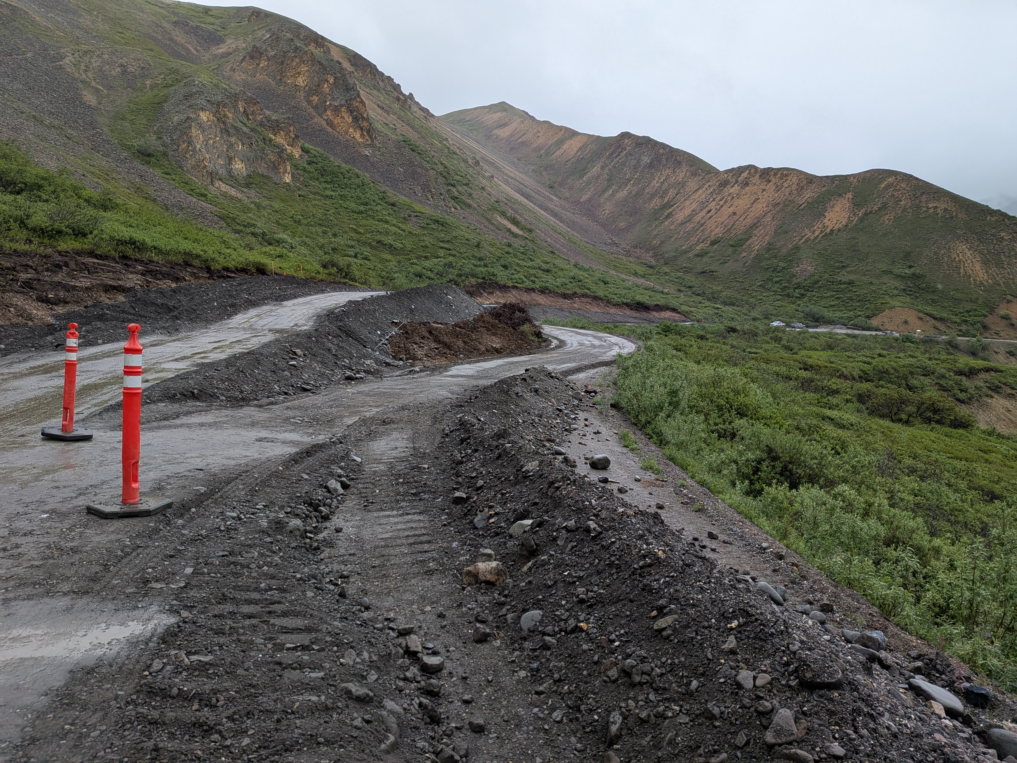 The gravel road splits into two routes for a brief section, one route sinks lower and one is built higher into the hillside.
