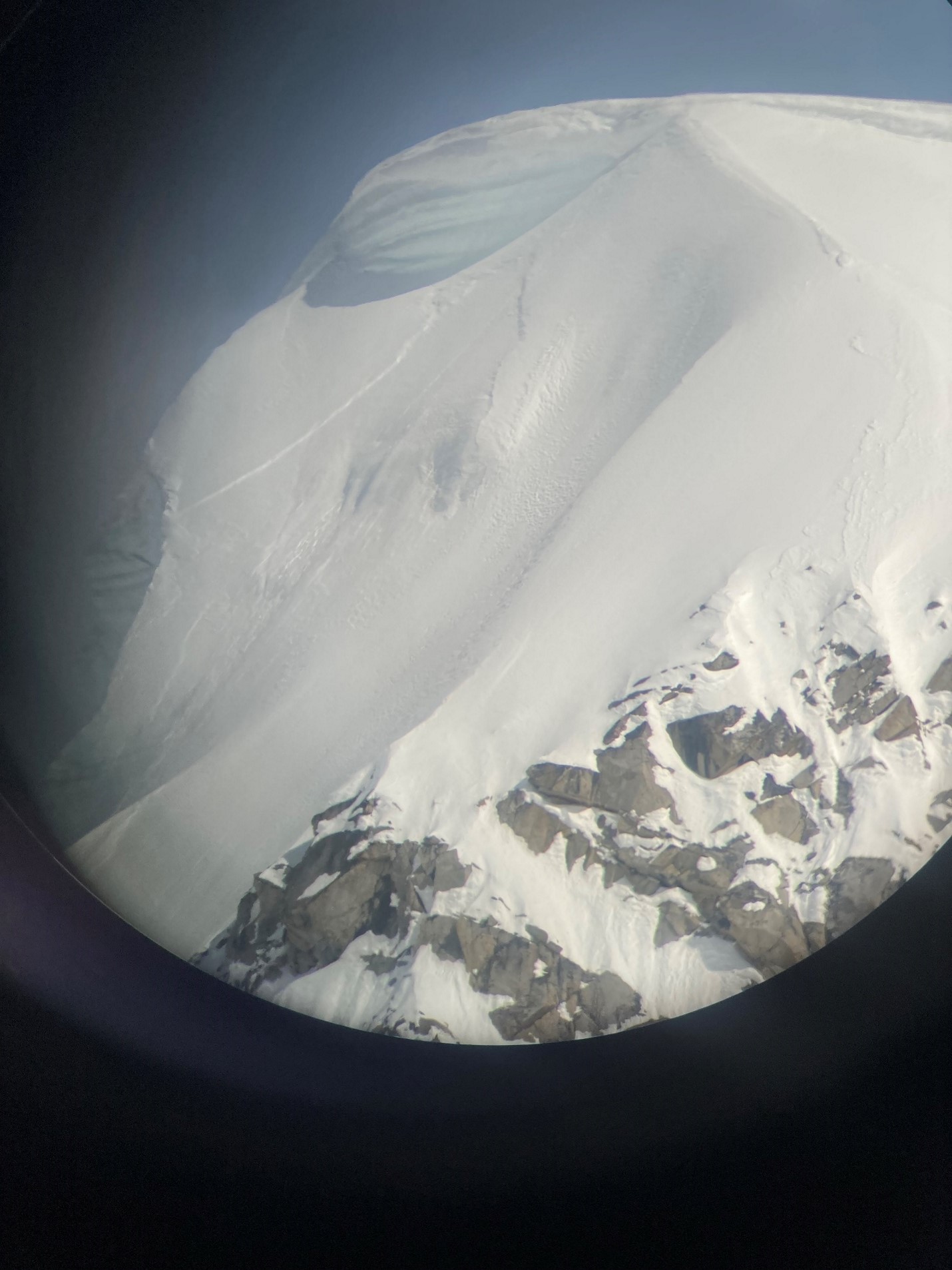 View of an avalanche from the window of a plane