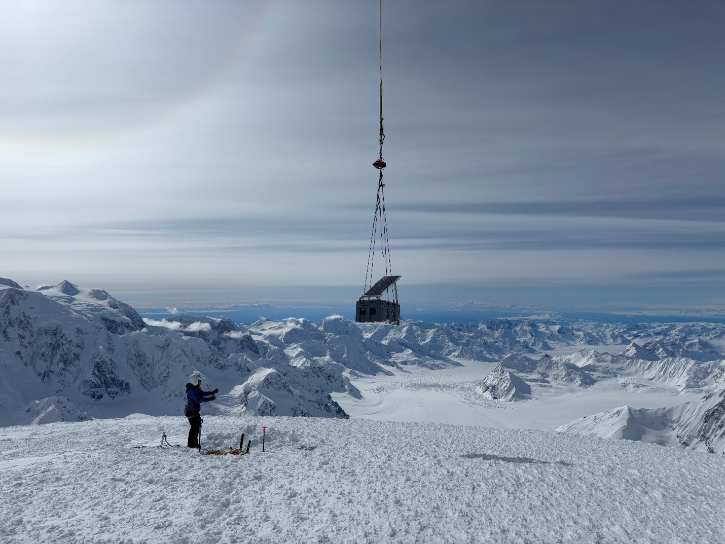 The Crosson repeater getting inserted on its lonely perch above the Kahiltna at 12,740’. Mt. Hunter can be seen on the left skyline. 