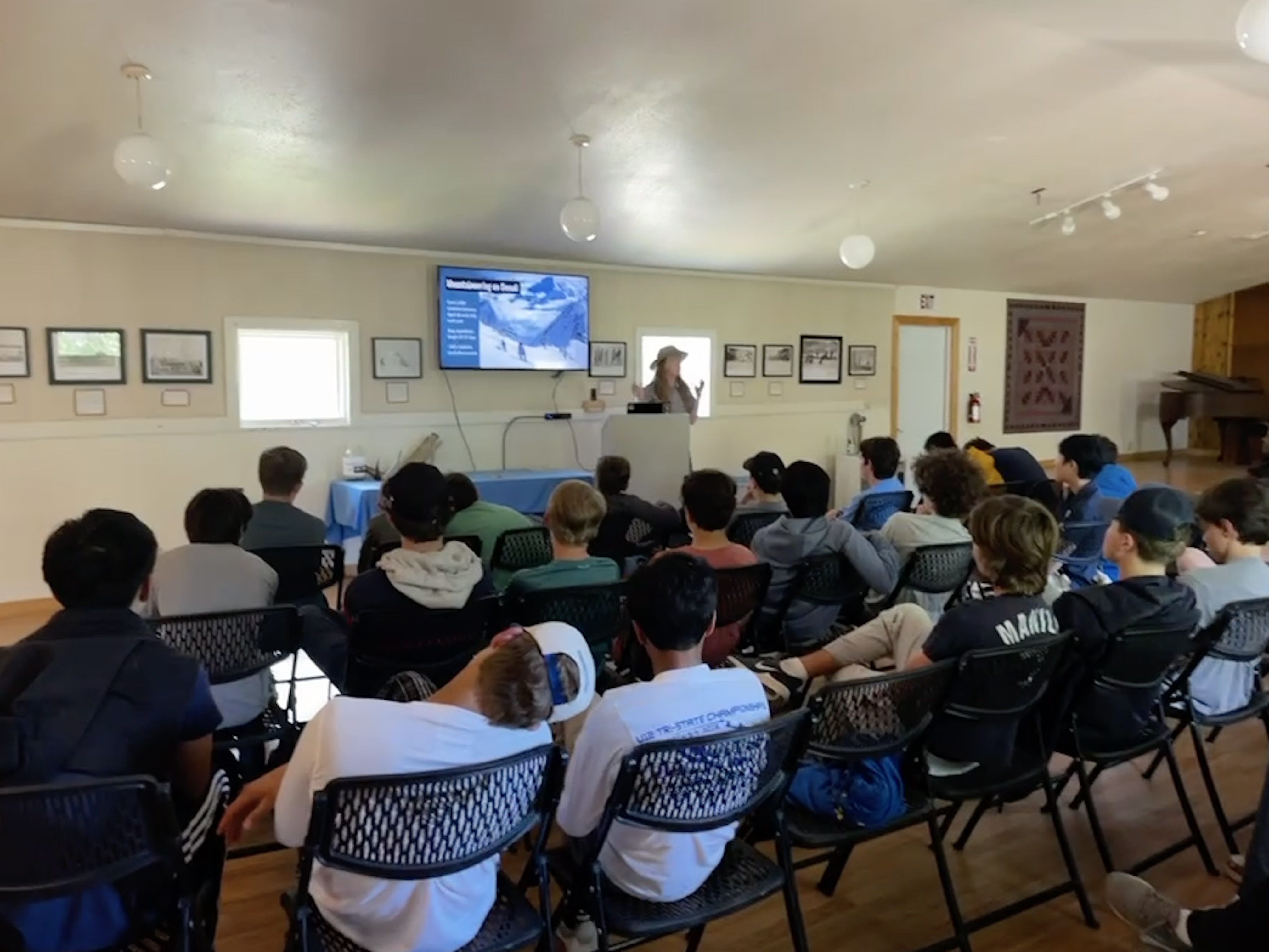 A ranger gives a presentation to an audience of students