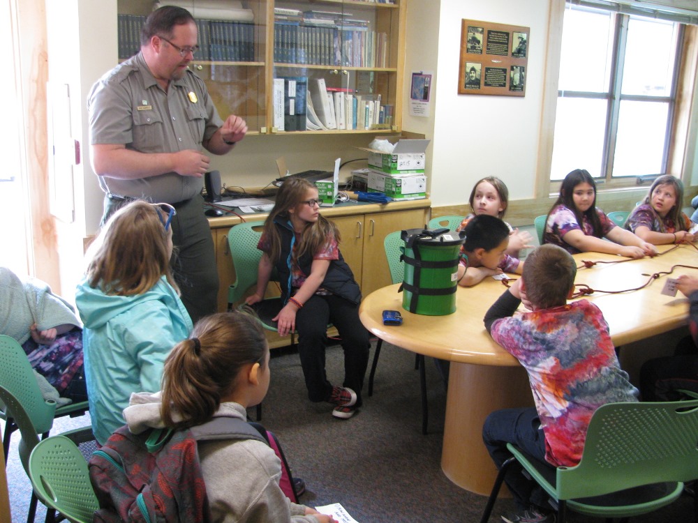 Ranger teaching kids about Leave No Trace practices