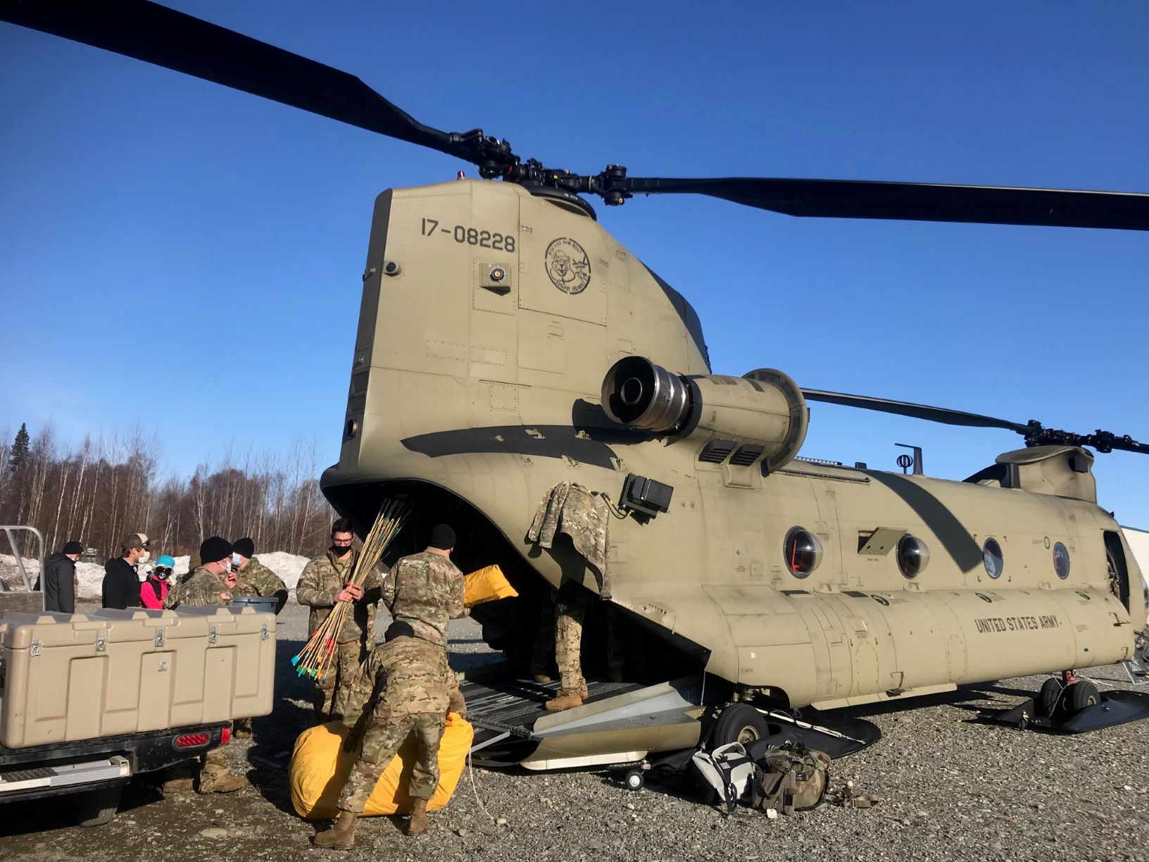 US Army soldiers load up Chinook helicopter with Denali mountain gear