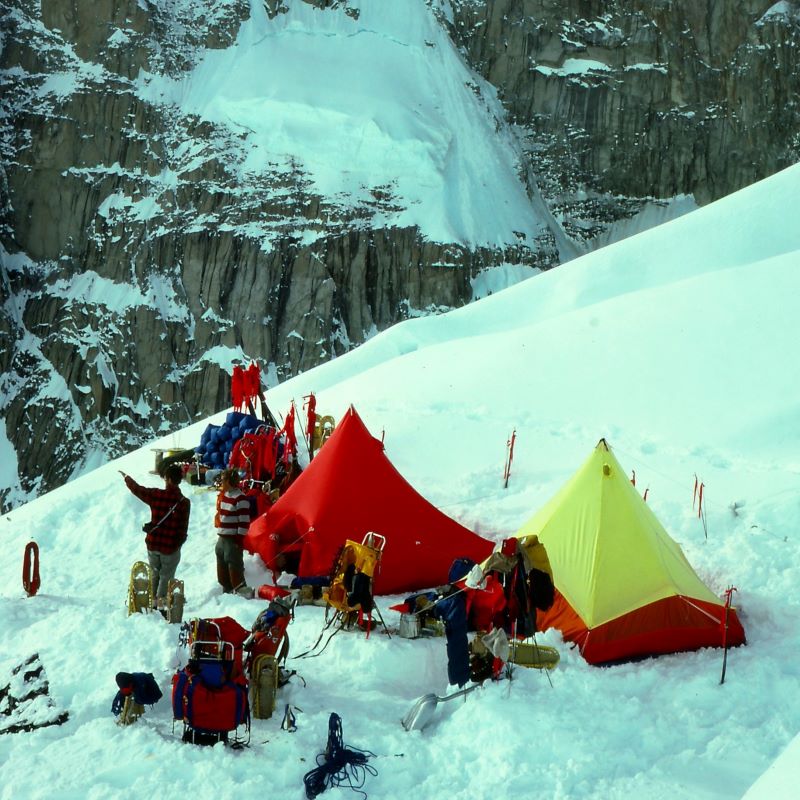 Overhead of a mountaineering camp with a red tent and yellow tent