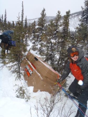 Knack box load stuck in trees and snow