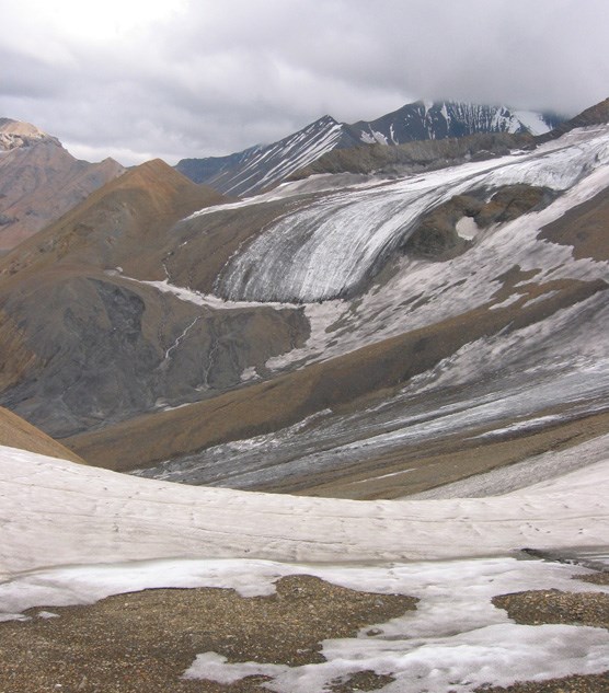 steep rocky slopes with ice and snow partly covering them