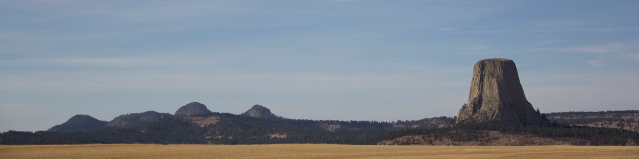 A panoramic view of Devils Tower and the Missouri Buttes from outside the park.