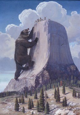 A giant bear climbing Devils Tower
