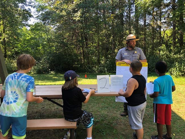 Children learning with a ranger.