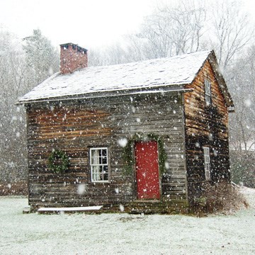 Rustic Cabin in a snowfall