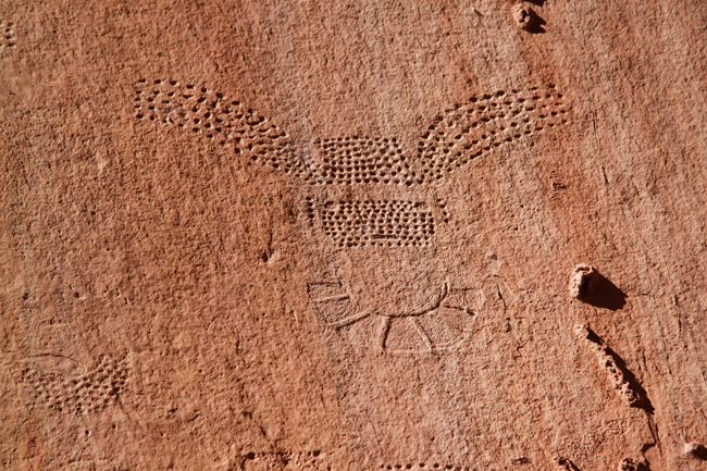 Pattern of dots pecked into a rock face