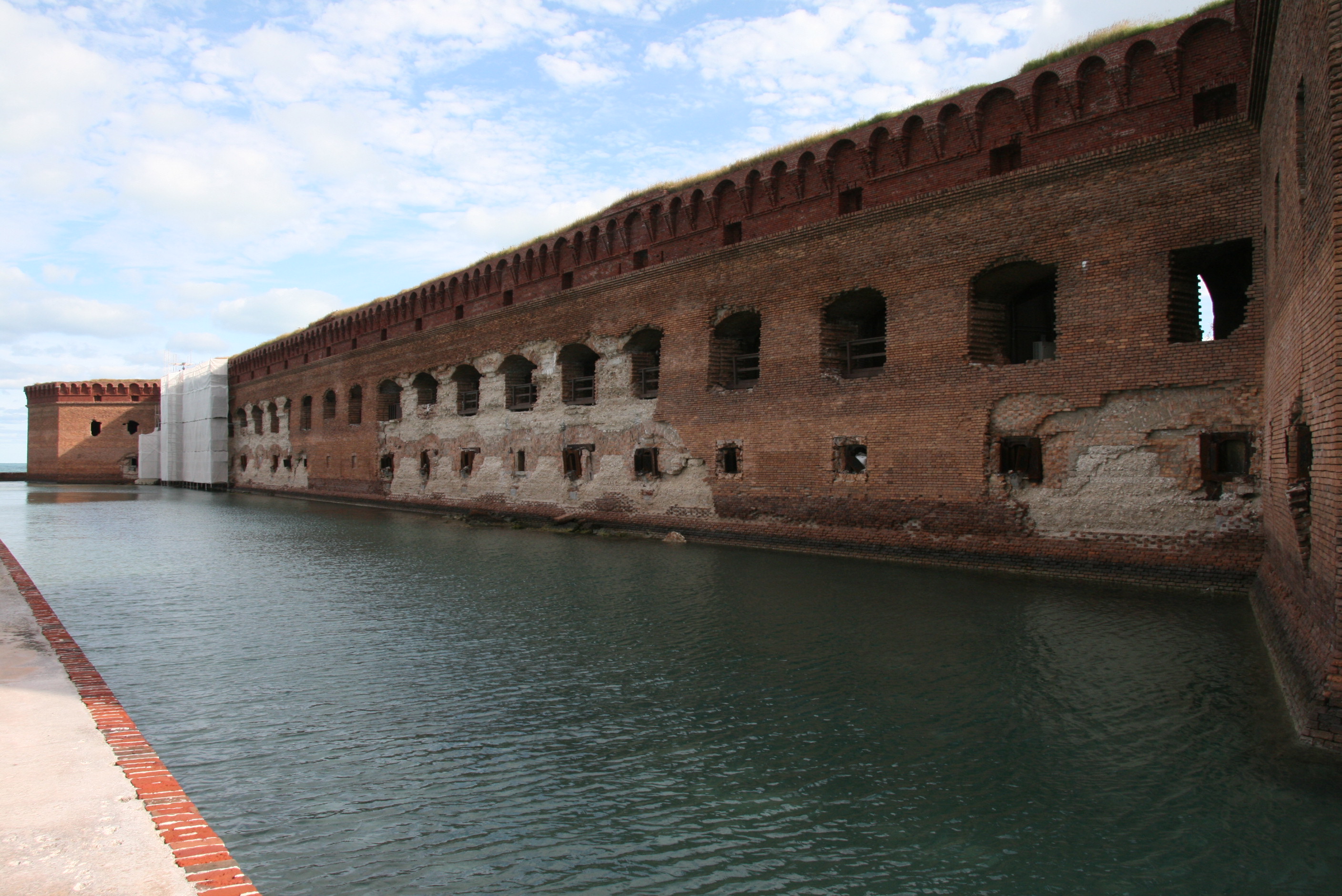 walk around the moat during your time at the fort, see if you can identify different areas of the exterior scarp wall that have been stabilized over time.