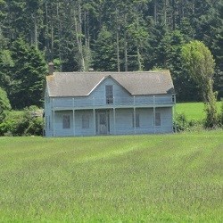 Old farmhouse in field