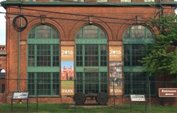 Front of Laboratory Building 5. Two banners celebrating the National Park Service hang on the brick facade.
