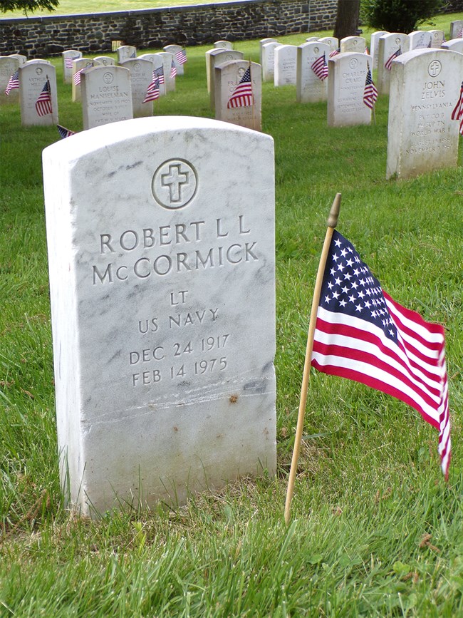 A white marble headstone for Robert McCormick in Gettysburg National Cemetery.