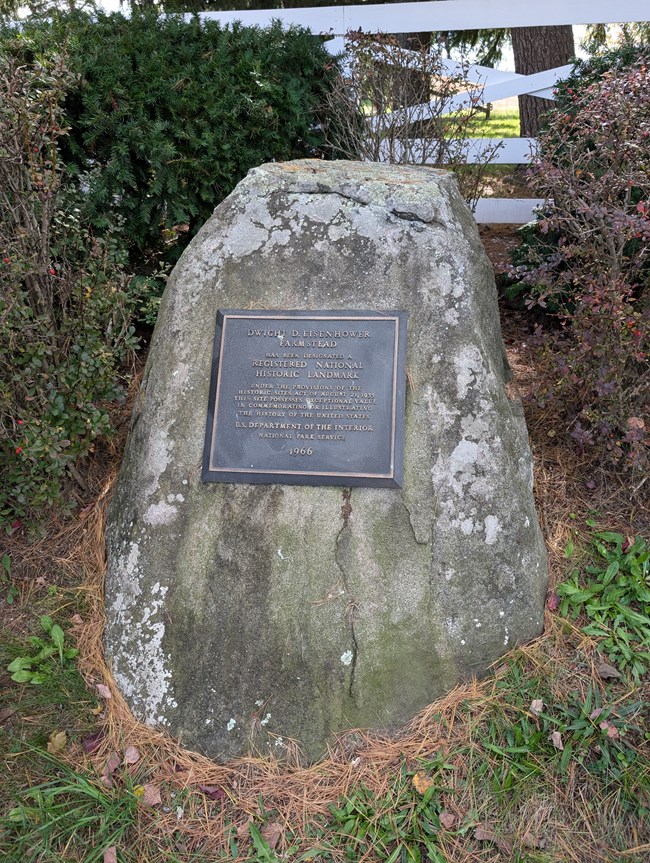 A boulder with a bronze plaque denoting Eisenhower National Historic Site