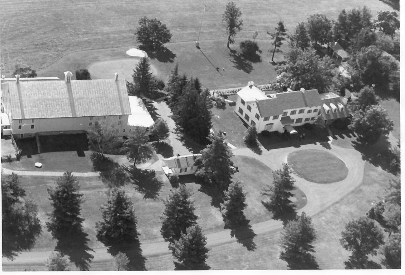 A black and white photograph showing an aerial view of the Eisenhower Farm