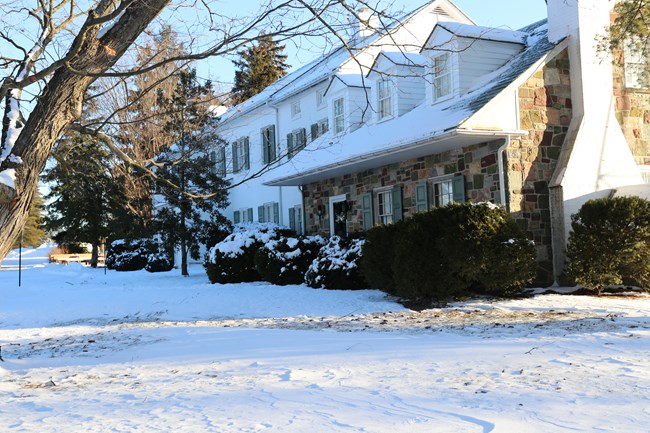 A picture of the Eisenhower home covered in snow during the winter season