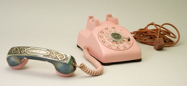 A pink rotary phone from the Eisenhower NHS museum collection