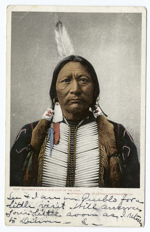 A historic portrait of an American Indian man in traditional regalia