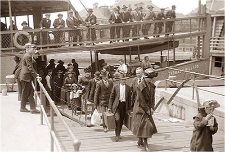 Immigrants disembarking at Ellis Island