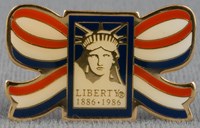 Brass pin, painted red, white and blue, with Statue of Liberty-Ellis Island Foundation logo, 1986