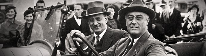 Two men in the front seat of a car