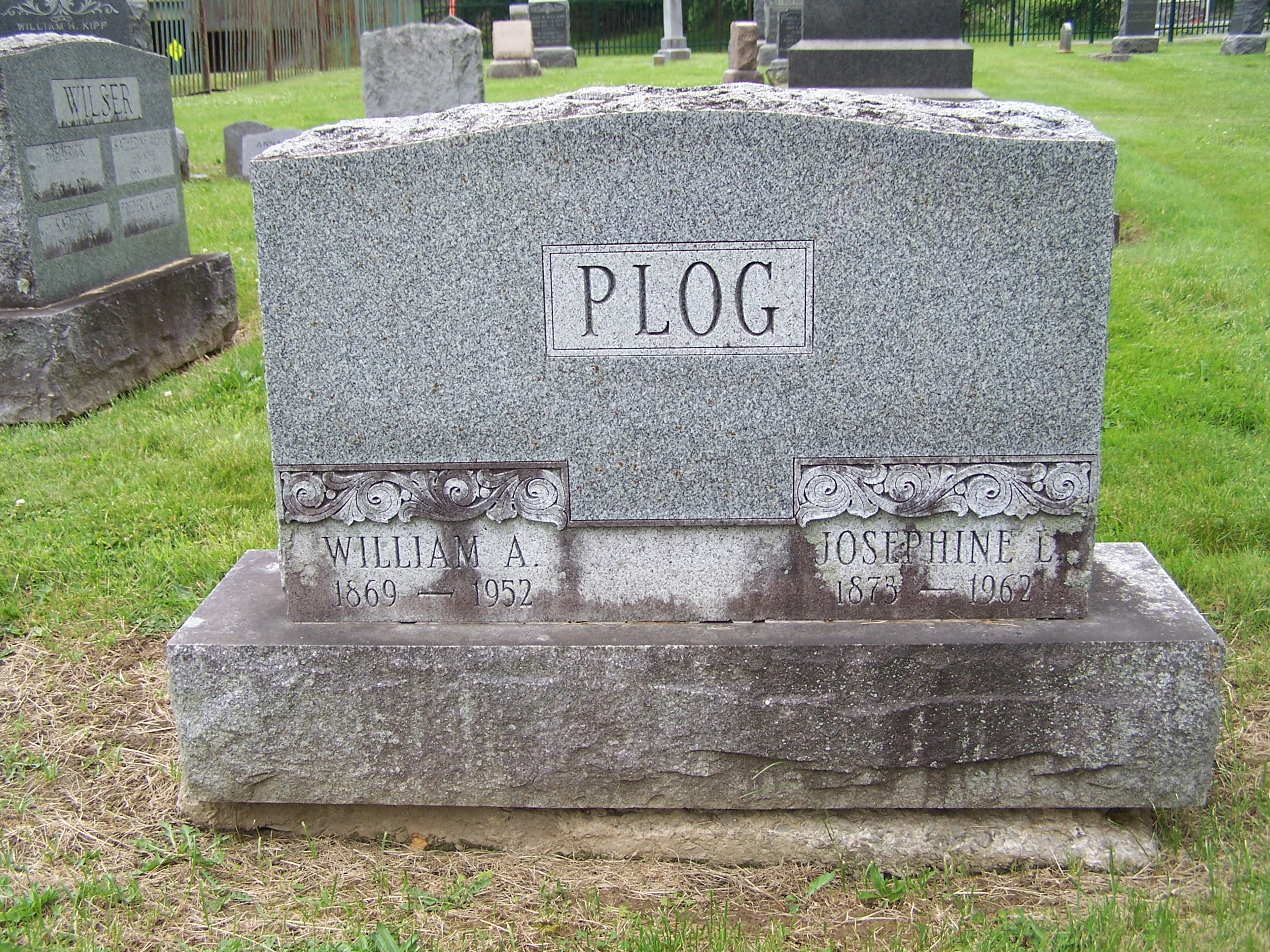 A gravestone, reading William and Josephine Plog