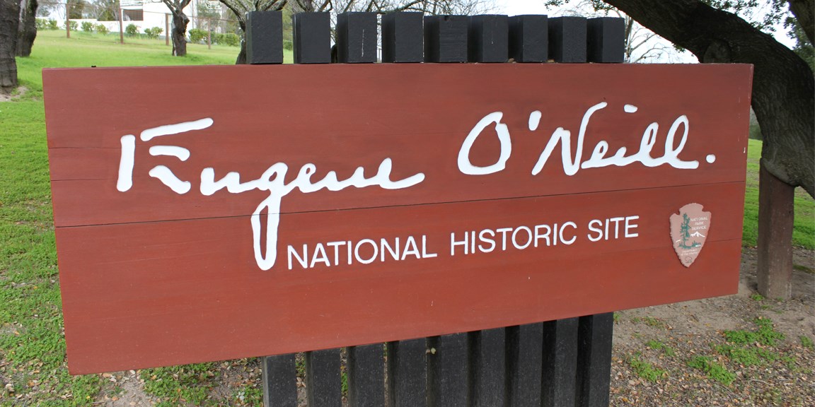 Wooden sign with Eugene O'Neill signature and park name