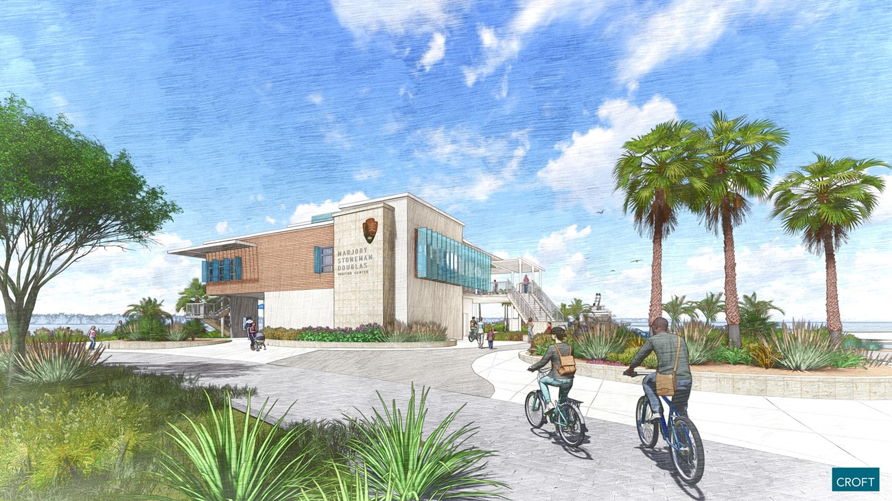 Artist rendering of the Marjory Stoneman Douglas Visitor Center and plaza. Two story modern building has various textures and architectural elements of interest. View of bay behind.