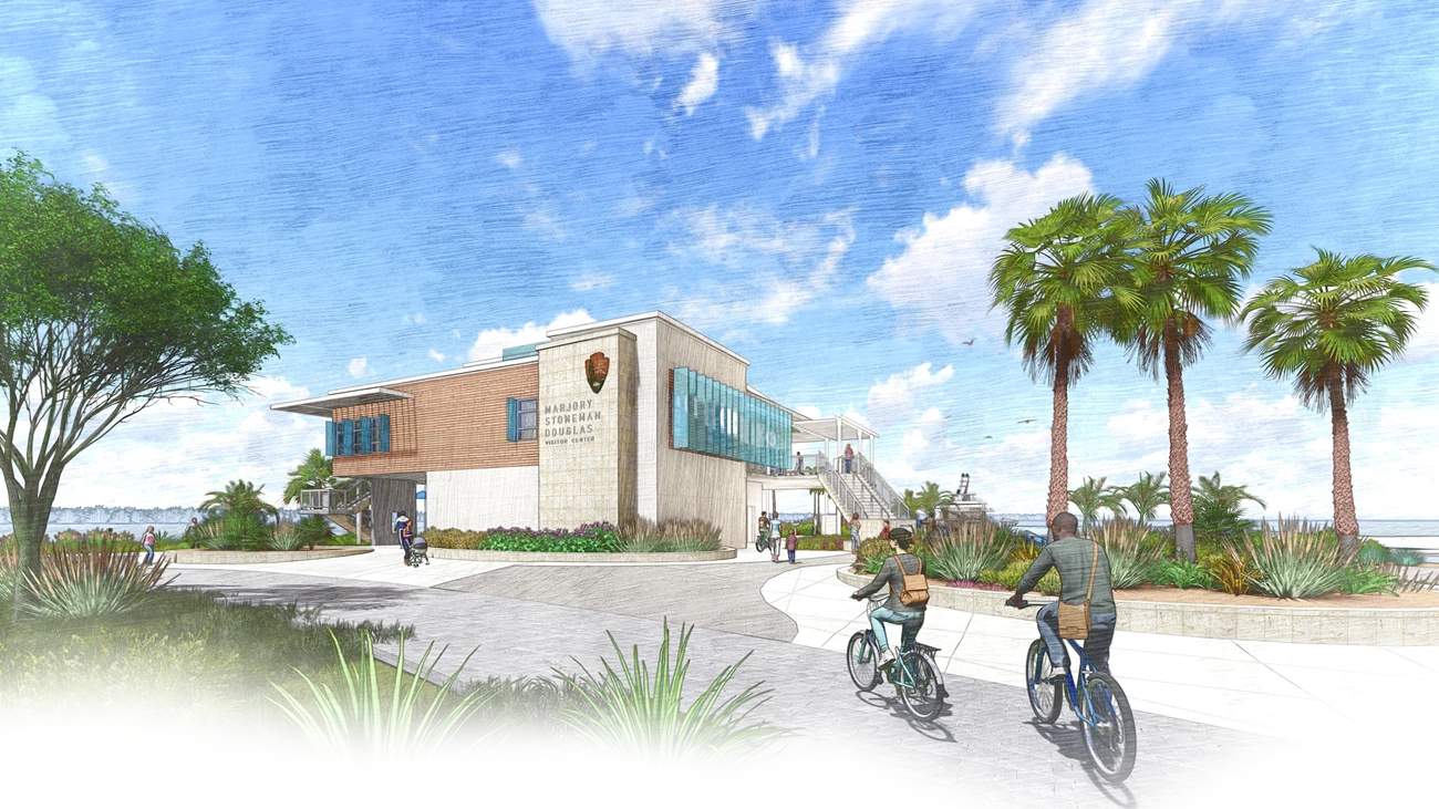 Artist rendering of the Marjory Stoneman Douglas Visitor Center and plaza. Two story modern building has various textures and architectural elements of interest. View of bay behind.
