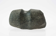 Stone with large indent in the middle.