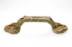 Side view of aged handle with sediment build up on it.