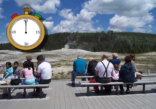 Visitors st on benches and await the next eruption of Old Faithful