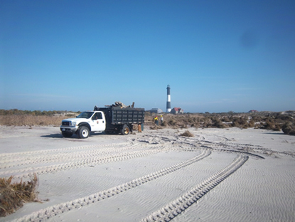 Flattened dunes and debris removal at Fire Island Lighthouse in November 2012.