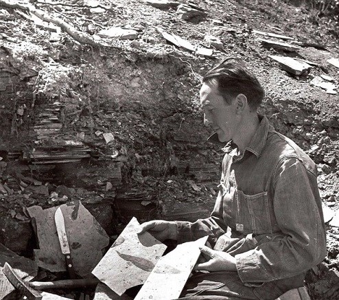 Harry MacGinitie working at an excavation site