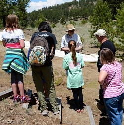Geologist talking with visitors at Excavation Site