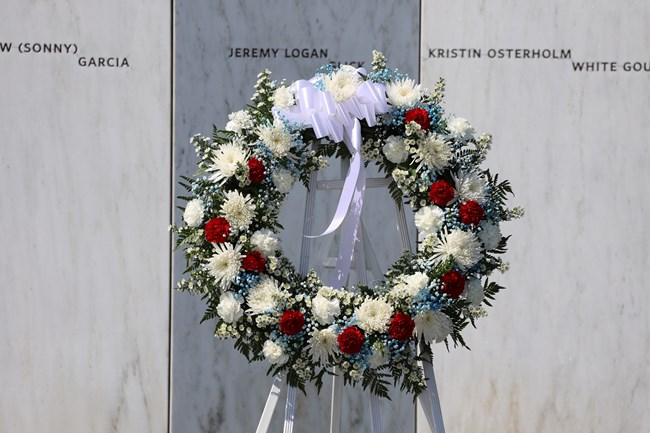 Wreath in front of the Wall of Names