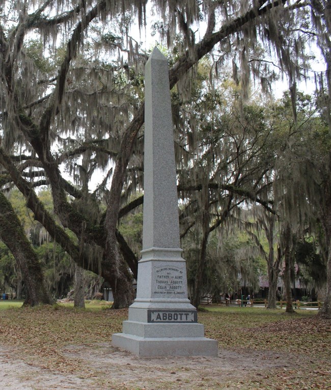 Tall granite obelisk with inscription commemorating Thomas and Celia Abbott