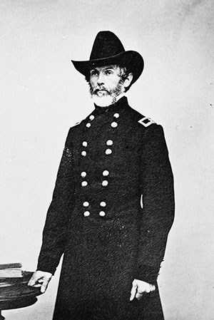 Man with beard in Civil War officers' uniform.