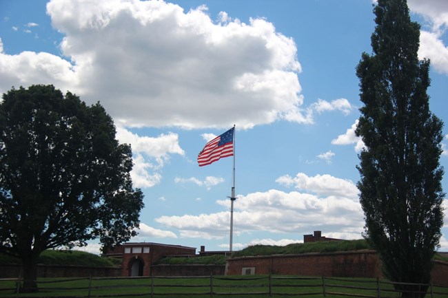 A photograph of the storm flag flying over Fort McHenry.