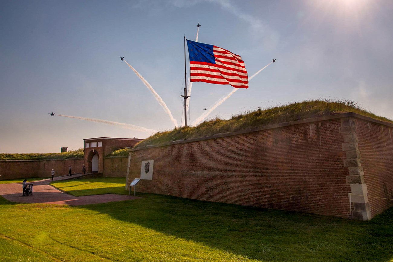 Fort McHenry with fighter jets in background